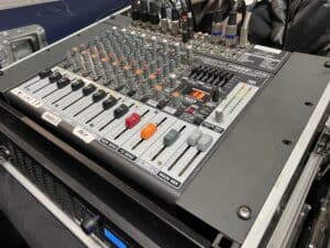 Close-up of professional audio mixing console.