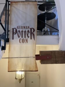 German Potter Con banner at event venue