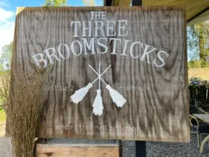 Wooden sign for The Three Broomsticks, serving butterbeer.