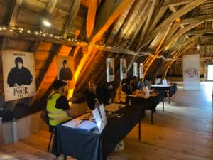 People at registration desk for German Potter Con event