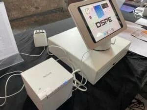 POS system with touchscreen display and printer on table