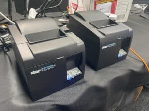 Two Star Micronics thermal printers on desk
