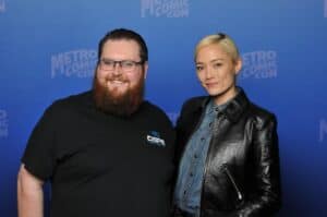 Man and woman posing at Metro Comic Con event.