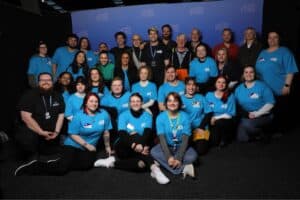 Group of volunteers at MetroCon event smiling