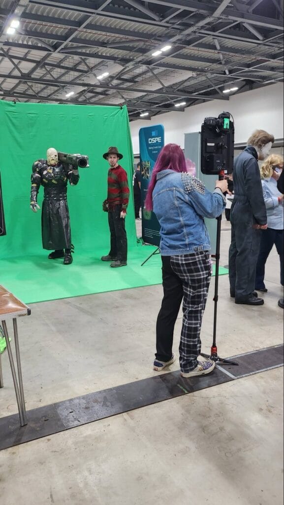 Cosplay photography at convention, green screen setup