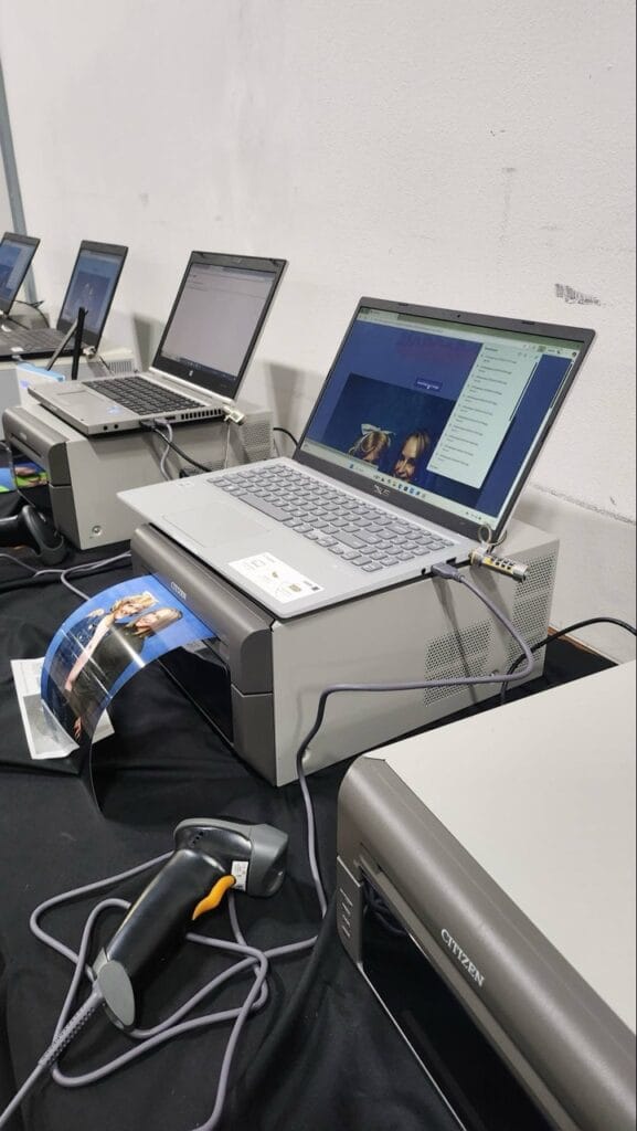 Laptops connected to printers on a workstation