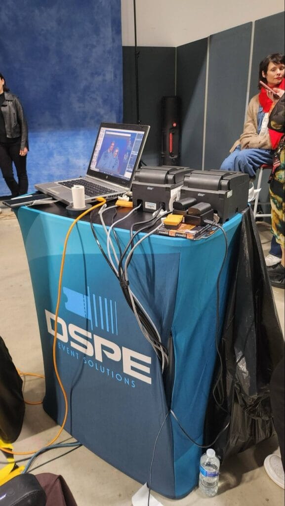 Event booth with laptop, printer and technical equipment