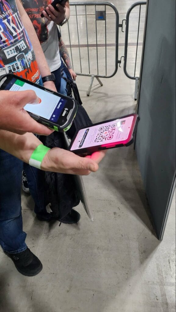 Person scanning QR code at event entry