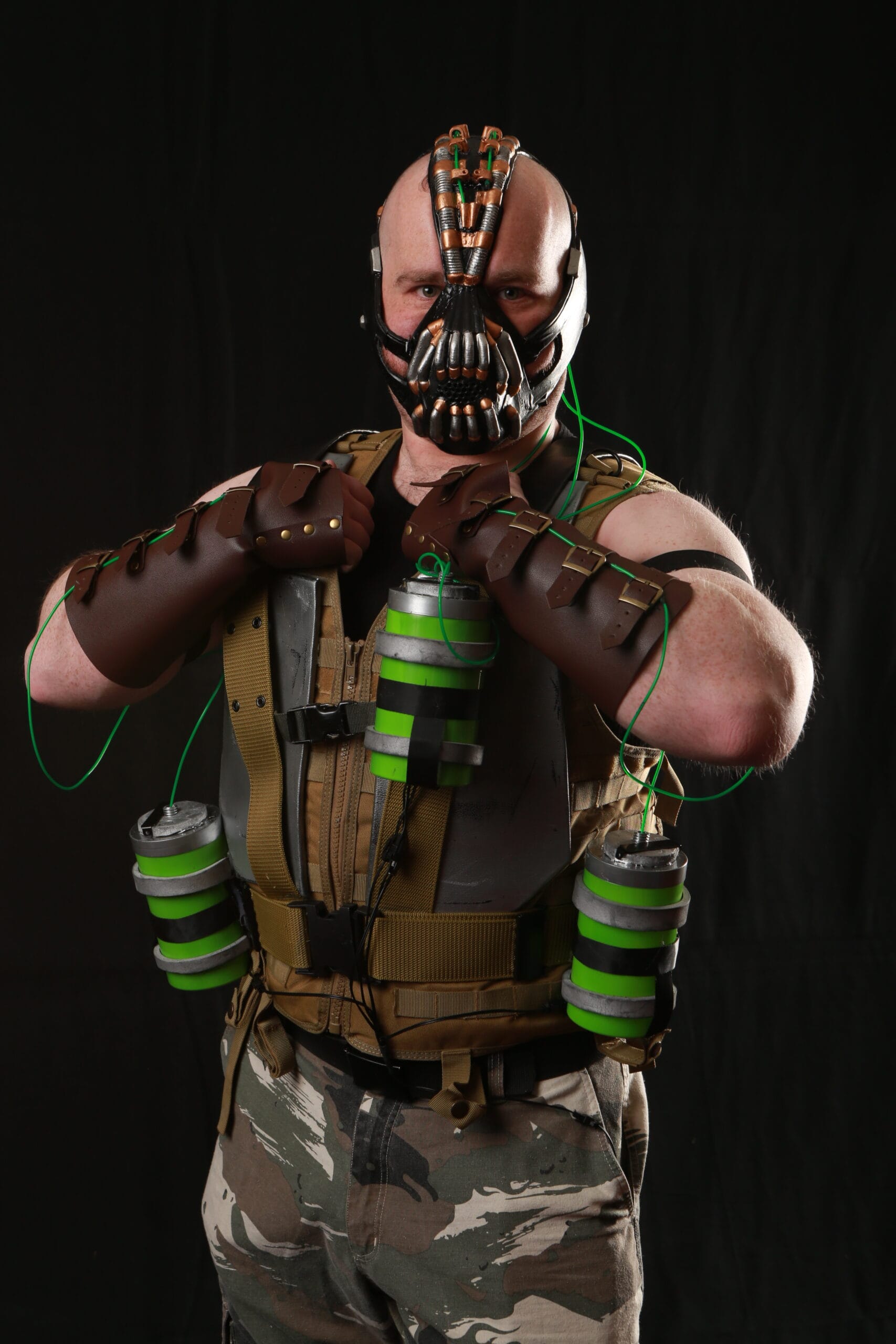 Person in Bane-inspired costume with mask and gear