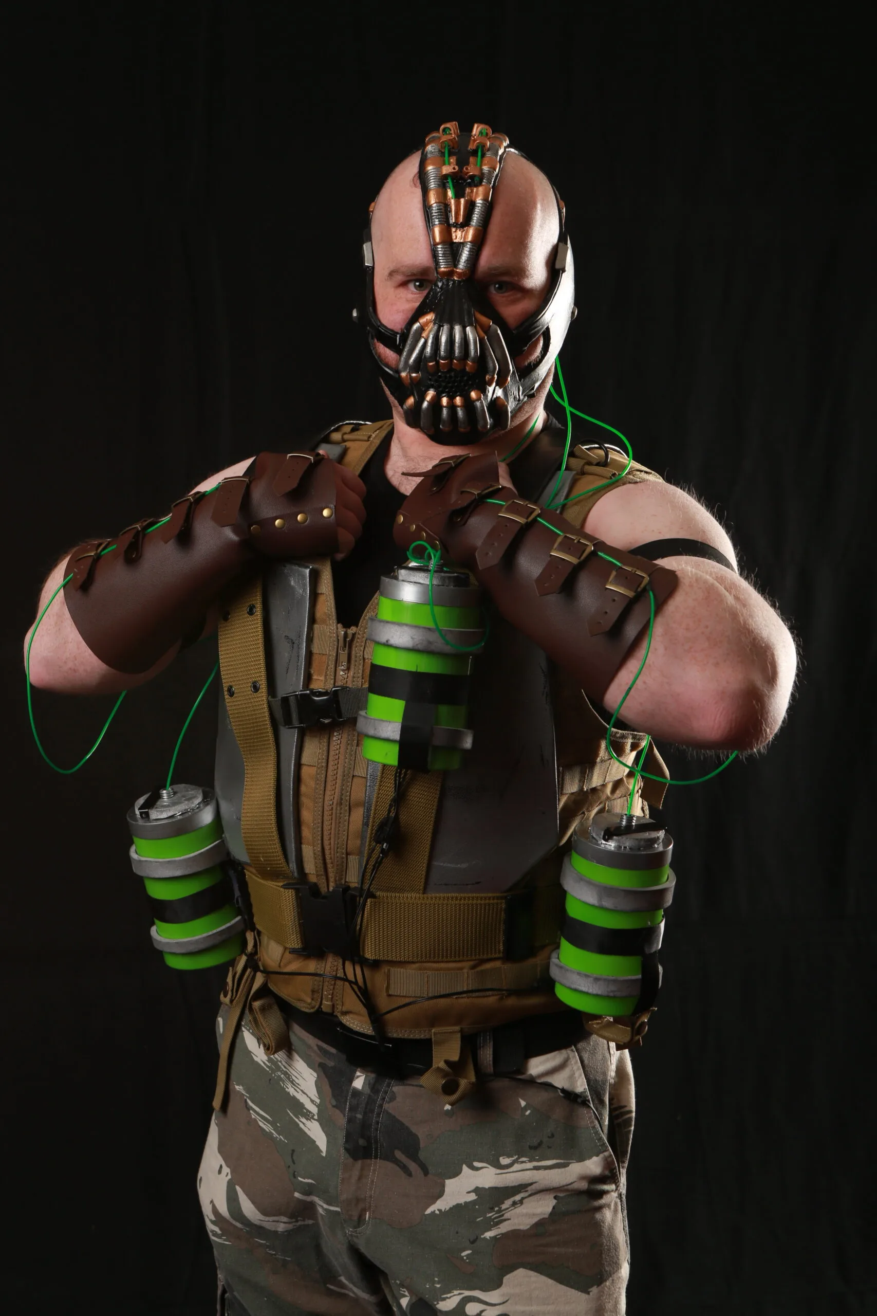 Person in Bane-inspired costume with mask and gear