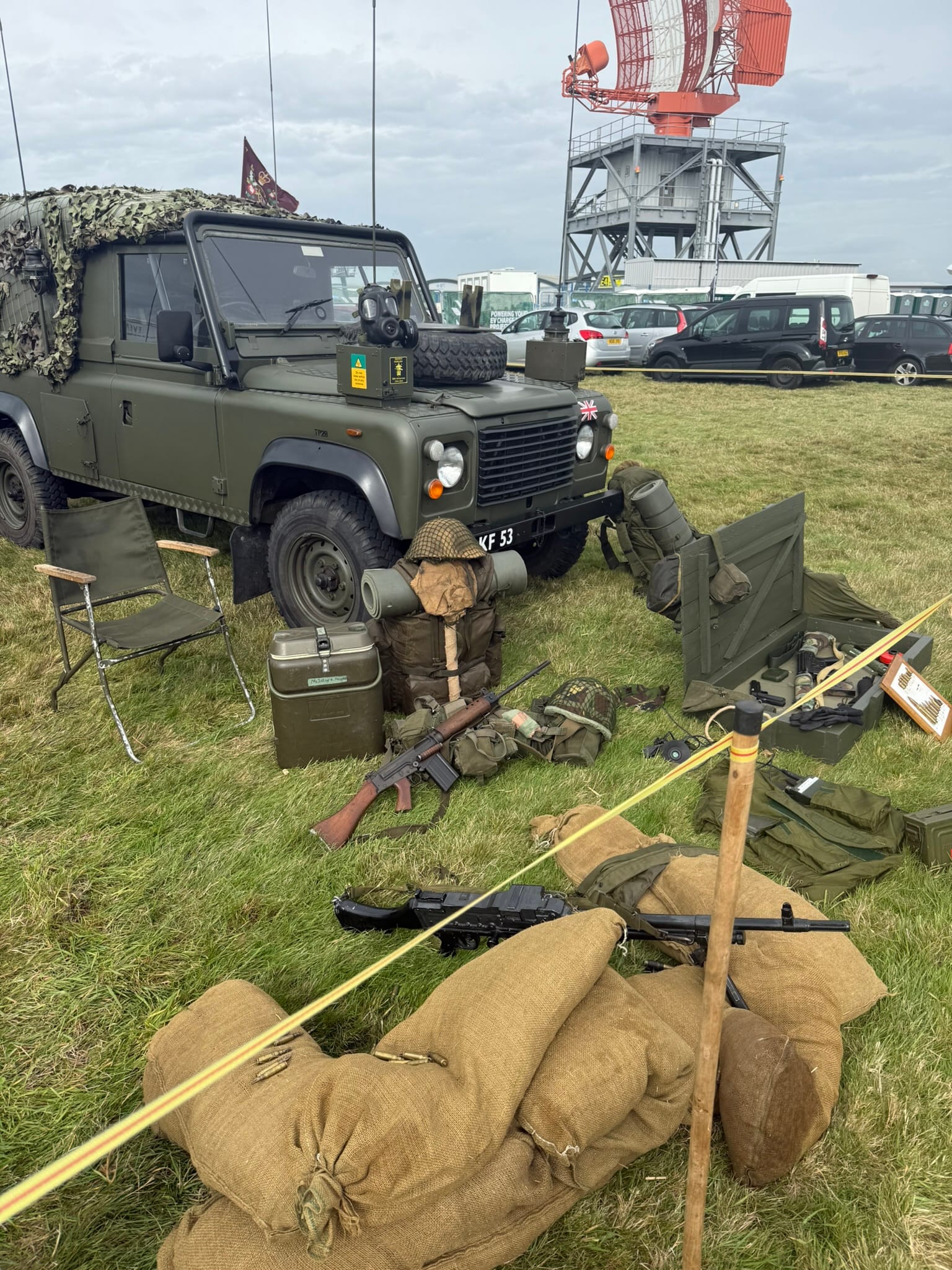 Military Land Rover with equipment display on grass
